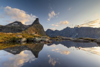 Romsdalshornet mountain reflected in mountain lake, Åndalsnes, Møre og Romsdal, Norway, Europe