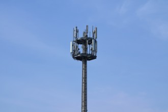 Mobile phone mast, transmission mast in front of sky, Hesse, Germany, Europe