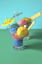 Homemade ice cream in glass bowls with waffle and umbrella, Summer, Germany, Europe