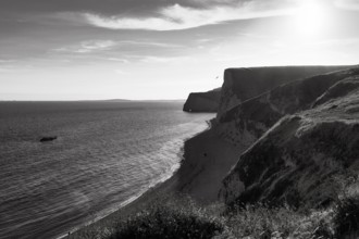 Durdle Door coastline, chalk coast backlit, monochrome, Dorset, England, Great Britain