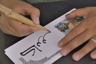 Calligrapher at work, Marrakesh, Marrakesh-Tensift-El Haouz region, Morocco, Africa