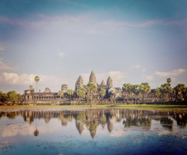 Vintage retro effect filtered hipster style image of Cambodia landmark Angkor Wat with reflection