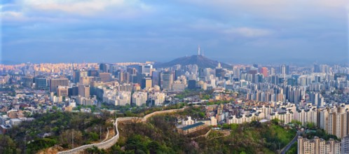 Panorama of Seoul downtown cityscape and Namsan Seoul Tower on sunset from Inwang mountain. Seoul,