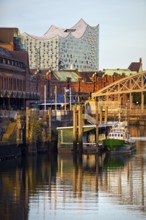 Customs canal with the ship of the Customs Museum of the Kornhaus Bridge and the Elbphilarmonie,