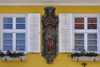 Figure of the Virgin Mary on a house façade, Nesselwang, Ostallgäu, Bavaria, Germany, Europe