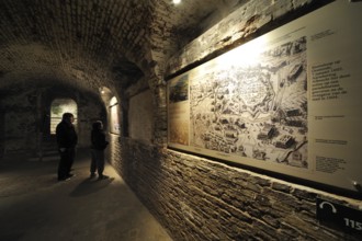 Tourists with audio guide visiting the exhibition inside the pentagonal Fort Napoleon in Ostend,