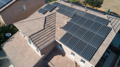 Solar panels installed on roof of large house