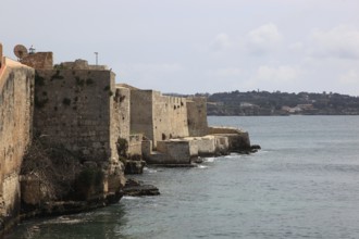 Ortygia or Ortigia is the historic centre of the city of Syracuse, the walls of the Castell by the