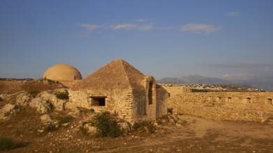 Fortezza, Venetian sea fortress, building inside the fortress, blue sky, few grey-white clouds,