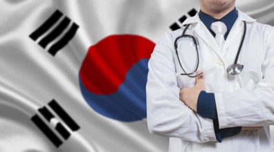 Doctor with crossed arms on South Korean flag. Medical health and care on South Korean flag. Doctor