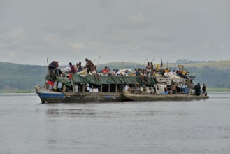 Overloaded boat on the Congo River, near Tshumbiri, Bandundu Province, Congo, Africa