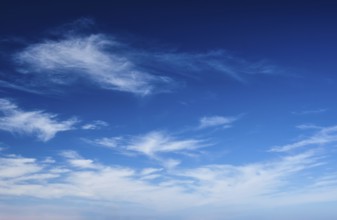 Blue clear sky with white cirrus spindrift clouds background