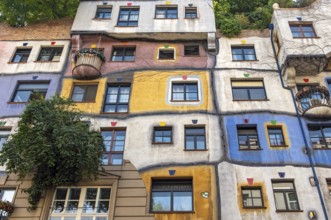 Colorful Facade of Hundertwasserhaus, apartment house designed by Friedensreich Hundertwasser in