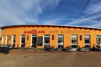 Colourful cafe, cocktail bar Jambolaya, gallery, decoration with West African handicrafts in the