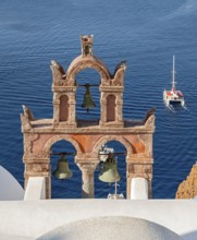 Old belfry wiith yacht and blue sea, Ia, Oia, Santorini, Greece, Europe