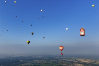 Many different hot air balloons in the blue sky, advertising, logo, hot air balloon festival, 26th