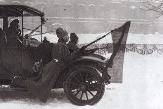 Revolutionaries hung at a car with the red flag, Saint Petersburg, 1917, Russia, Europe