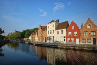 Typical Belgian cityscape Europe tourism concept, canal and old houses on sunset. Bruges (Brugge),