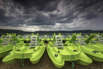 Pedal boats on the beach in Sainte Croix du Verdon, Lac de Sainte-Croix, thunderstorm atmosphere,