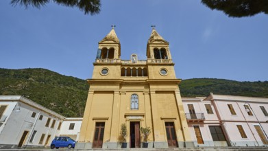 Super wide angle, oblique from below, ochre-coloured facade, two church towers, Santuario della