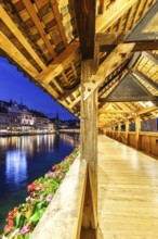 Chapel Bridge town on the river Reuss with bridge at night in Lucerne, Switzerland, Europe