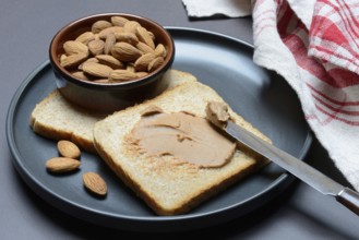 Toast with almond cream and almond shell, spread