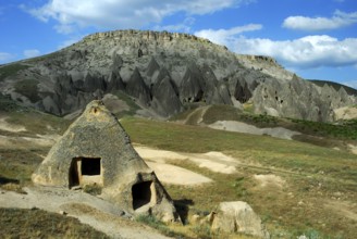 Cave dwelling in tuff rock, Selime, Güzelyurt, Turkey, Asia