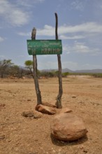 Sign at the entrance to the village of Omuramba, residential village of Chief Hikuminue Kapika, the