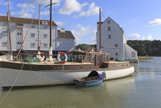 Historic boat and Tide Mill on the waterfront, River Deben, Woodbridge, Suffolk, England, UK