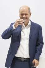 Olaf Scholz (Chancellor of the Federal Republic of Germany, SPD) drinks an espresso during a press