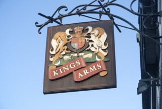 Close-up of pub sign for the Kings Arms against blue sky, Weymouth, Dorset, England, United