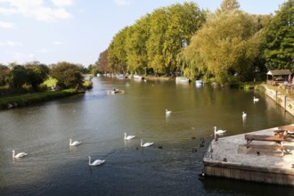 Boats on the River Thames in autumn at Lechlade on Thames, Gloucestershire, England, UK