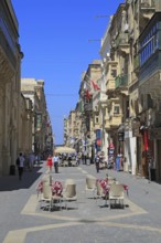 Busy city centre pedestrianised street in Valletta, Malta, Europe