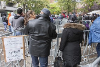 Refugees from Syria waiting to be registered at the Central Reception Centre for Asylum Seekers at