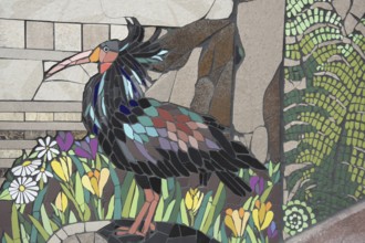 Wall mosaic with bald ibis by Isidora Paz López 2019, one, brown, bird figure, flower figures,