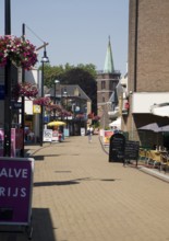 Almost deserted main shopping street at noon on very hot summer day, Sliedrecht, Netherlands