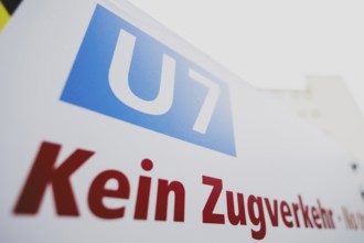 A sign indicates the suspension of train services on the underground line 7 in Berlin, 27 February