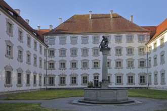 Inner courtyard with baroque illusion architecture, illusion painting and fountain with figures,