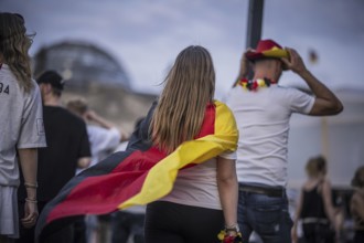 Scenes in the fan zone on Platz der Republik in front of the Reichstag building taken in Berlin, 29