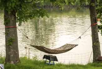 Campsite, hammock on the banks of the Ruhr, Mülheim an der Ruhr, North Rhine-Westphalia, Germany,