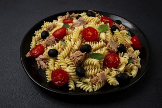 Tuna salad, fusilli pasta, olives and cherry, olive oil, homemade