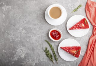 Homemade red velvet cake with milk cream and strawberry with cup of coffee on a gray concrete