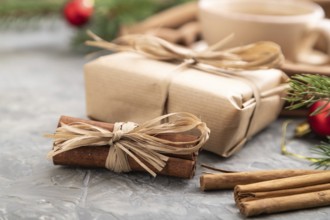 Christmas or New Year composition. Decorations, box, cinnamon, fir and spruce branches, cup of