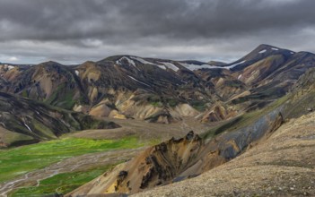 View from Sudurnamur peak, mountains, river and lava field, volcanic landscape, Landmannalaugar,