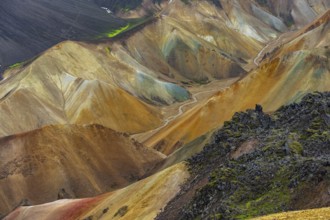 Small river between colourful rhyolite mountains, volcanic landscape, erosion landscape, view from