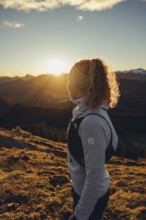 Trail running in autumn on the Jochberg on Lake Walchensee against the wonderful backdrop of the