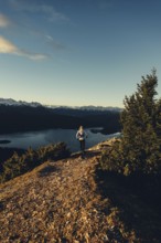 Trail running in autumn on the Jochberg on Lake Walchensee against the wonderful backdrop of the