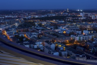 View of the city from the City Tower at blue hour towards the Monument to the Battle of the