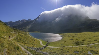 Fog over the mountain ridge at the upper Giglachsee, Schladming, Styria, Austria, Europe