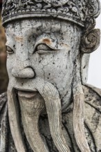 Stone sculpture in Wat Pho temple, head, face, weathered, Buddhism, religion, world religion,